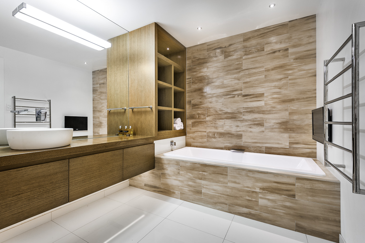 Tiled feature wall, precision joinery, Plank tiles, bathroom tile installation, Terranova Tiling services, tile installation in Christchurch, tiling industry expert, tile installation craftsman, Christchurch tile laying professional, installation of floor and wall tiles
